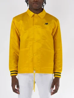 NEW BALANCE Giacche<GIACCA GREATEST HITS COACHS Giallo