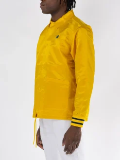 NEW BALANCE Giacche<GIACCA GREATEST HITS COACHS Giallo