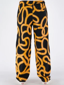 MARCELO BURLON Pantaloni<PANTALONE ALL OVER SNAKES TRACK Giallo, Nero