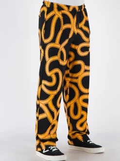 MARCELO BURLON Pantaloni<PANTALONE ALL OVER SNAKES TRACK Giallo, Nero