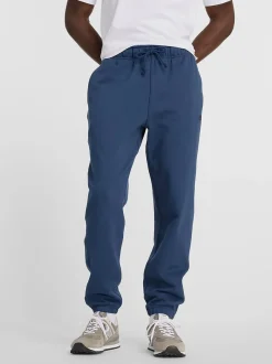 NEW BALANCE Pantaloni<PANTALONE JOGGER ATHLETICS FRENCH TERRY Blu, Nero